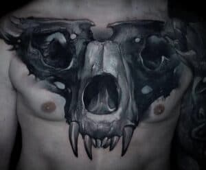 Animal Skull On Chest Tattoo